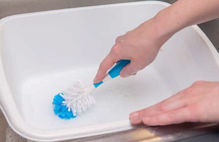 Clean the wash basin, scrub brush, and drying rack with soap and safe water. Rinse and air dry.