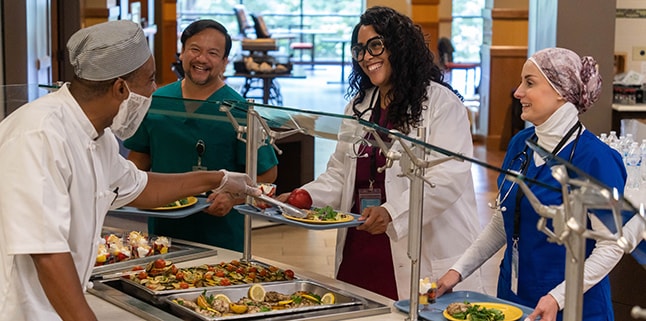 Employees get lunch at hospital cafeteria