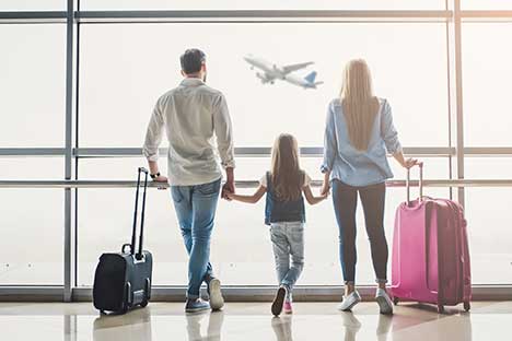 Family waiting for airplane at airport