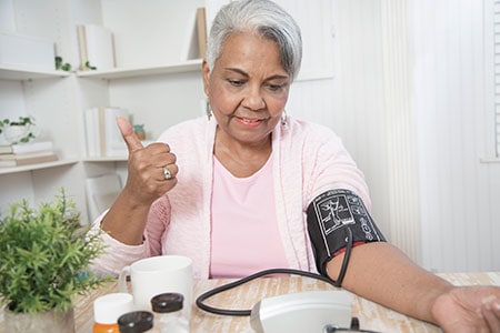 woman taking blood pressure