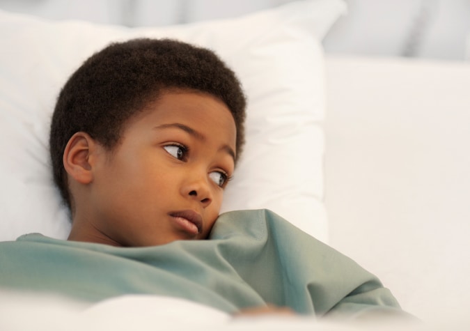 Boy sick in hospial bed