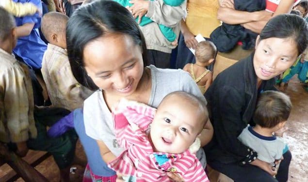 Moms and their kids at an immunization session in Lao-PDR. Photo courtesy of Karen Hennessey, CDC.