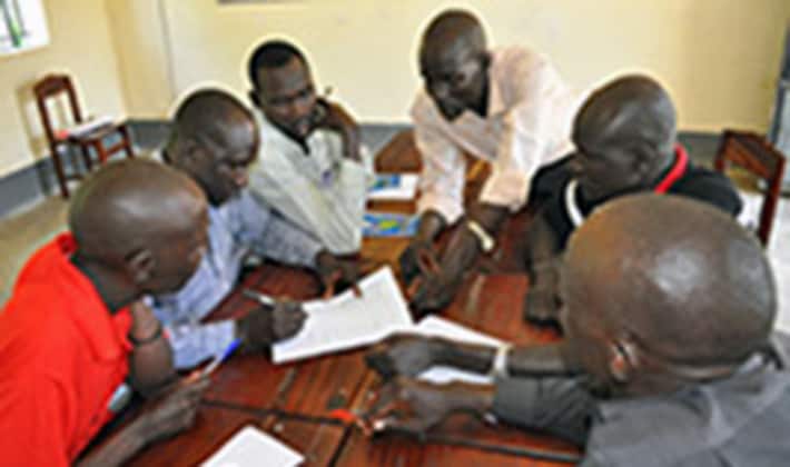 South Sudanese immunization officers working on a case study to apply new knowledge