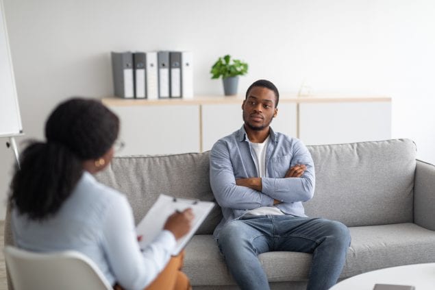 Psychological counselling. Black male patient with depression