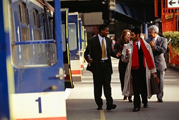 Business people walking on train platform