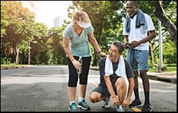 The figure shows a group of older adults exercising in a park.