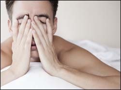 The figure above is a photograph showing a man who is having trouble sleeping.