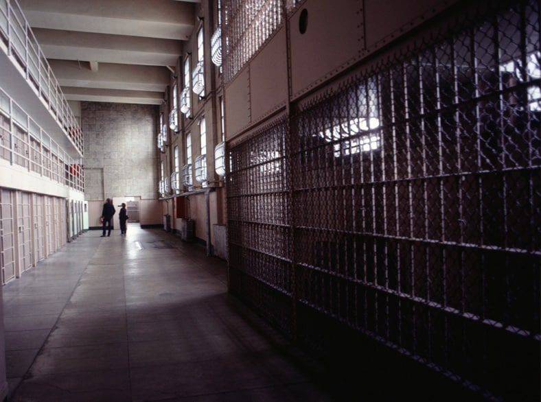 Prison hall with a number of prison cells.