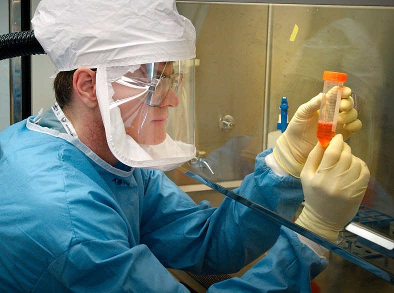 CDC lab worker checking samples. 