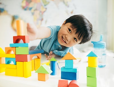 Little boy creating new cities stock photo
