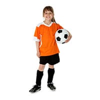 School aged child holding a soccer ball