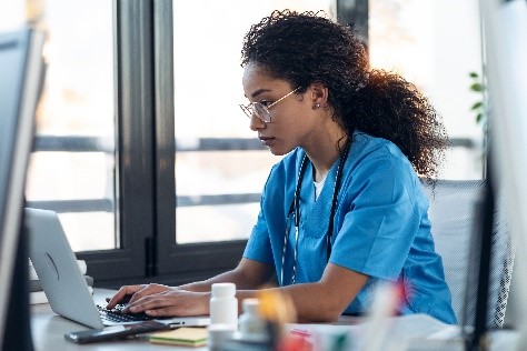 Health care worker at her computer