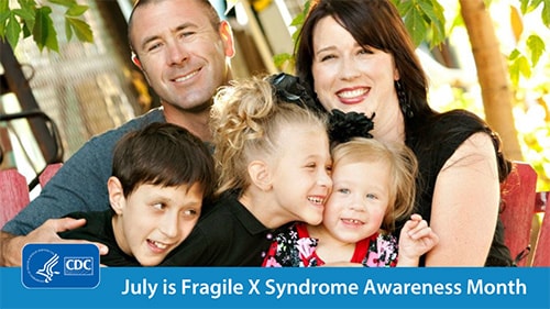 Family sits on bench outdoors smiling. Text reads, 'July is Fragile X Syndrome Awareness Month'