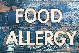 Photo of a sign that says Food Allergies.
