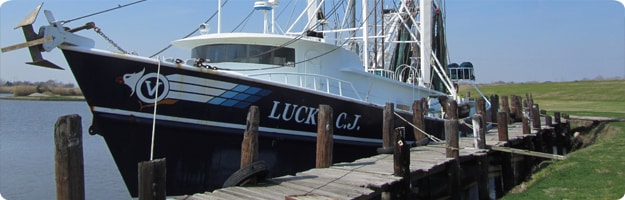 A photo of a side-trawl shrimp boat tied up at the dock. Photo by NIOSH