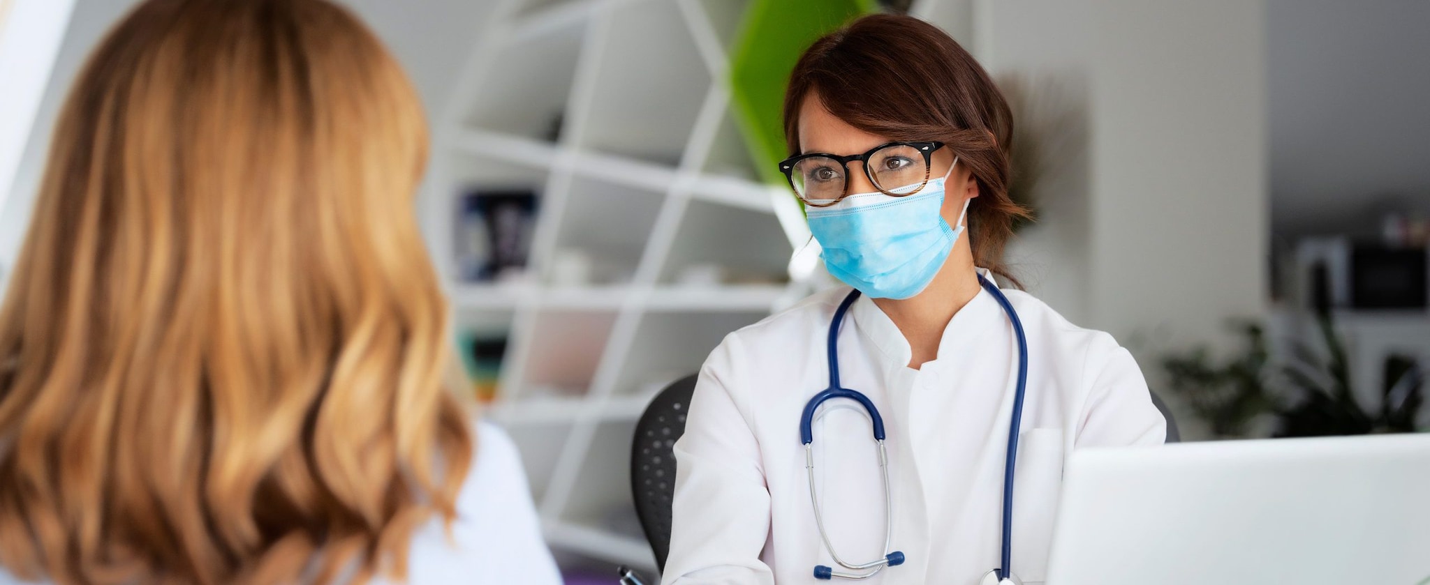 Doctor Wearing Face Mask While Listening To The Patient