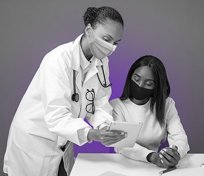 photo of a doctor showing medical info to a patient