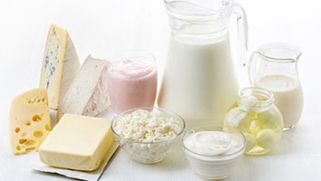 Various dairy products including milk, cheeses, and butter