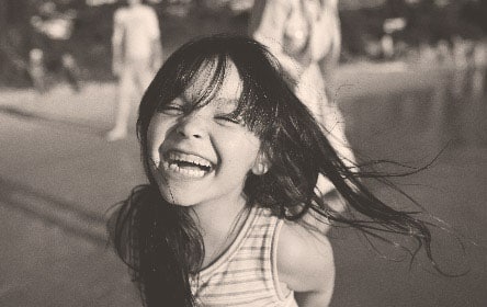 laughing girl at the beach.