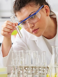 lab scientist working with test tubes