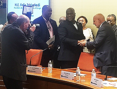 Jim Gathany snaps a photo of CDC Director Dr. Robert Redfield shaking hands with Felix Tshisekedi, the president of the Democratic Republic of the Congo