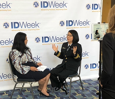 CDC Medical Officer Mary Choi, right, recounts some of her experiences in the current Ebola outbreak after a session at the October 2019 IDWeek conference in Washington.