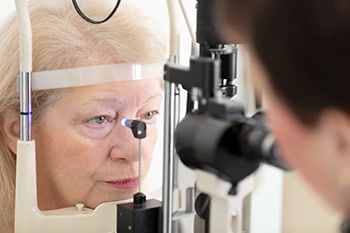elderly woman getting eye exam