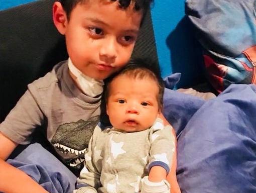 Francisco with his little brother.