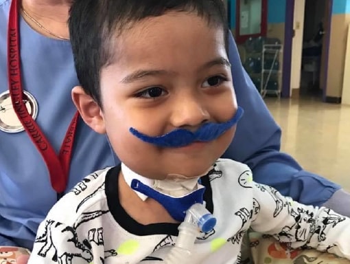 Francisco in the hospital wearing a fake moustache.