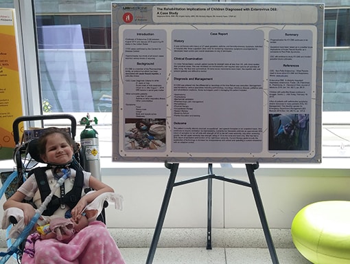 Kinley at a poster presentation. 