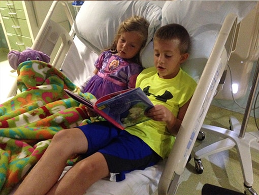 Laura in the hospital with her brother.