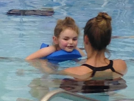 Lauren swimming in a pool.