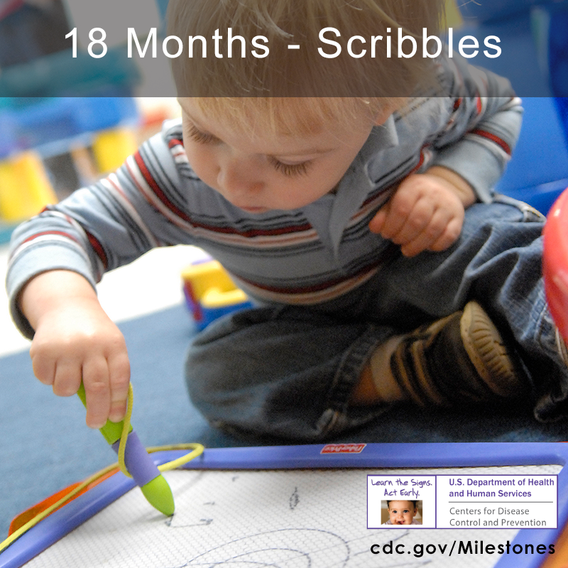 The child in this photo is scribbling with a toy pen.