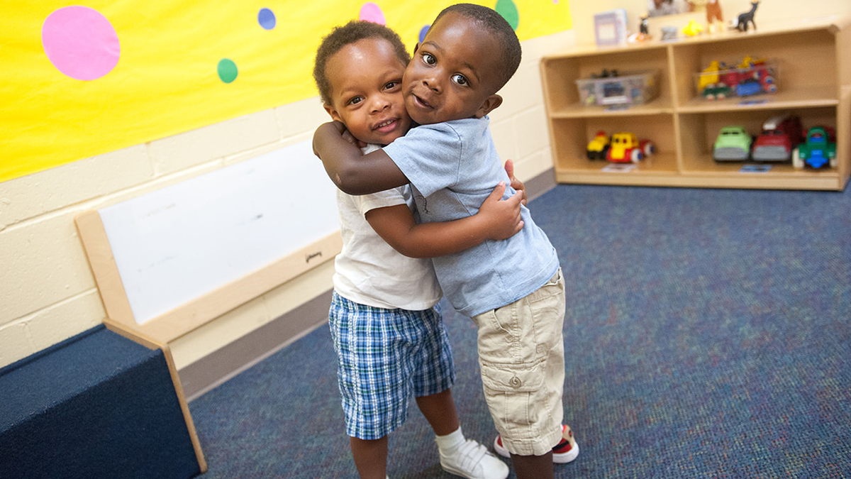 two children hugging