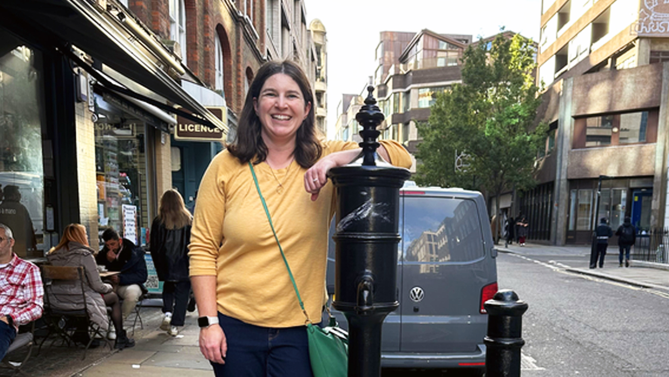 Woman with dark hair smiling at the camera