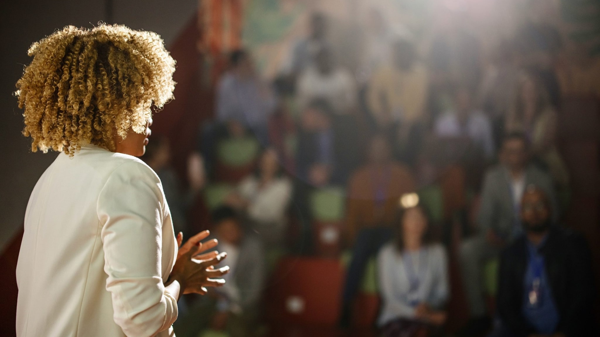 Woman presenting in front of audience