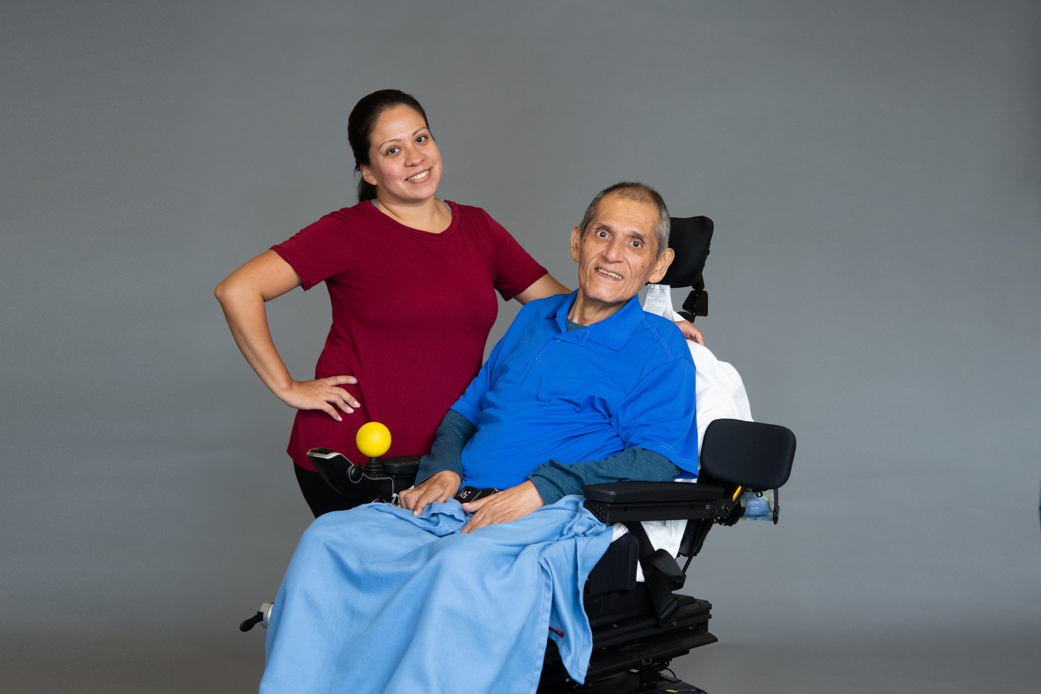 photo of ALS patient in wheelchair and his caretaker