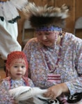 Woman and child in traditional Alaska Native clothing.