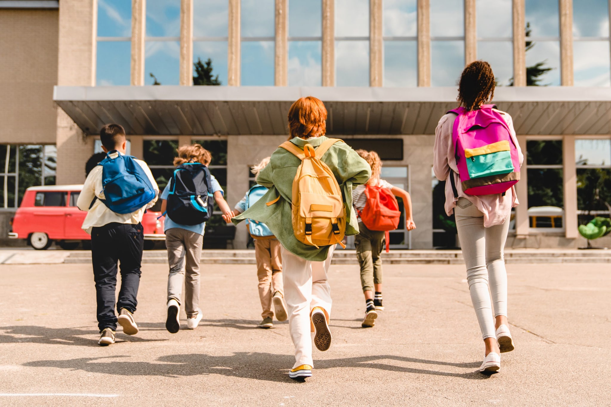 Students walking into a school.