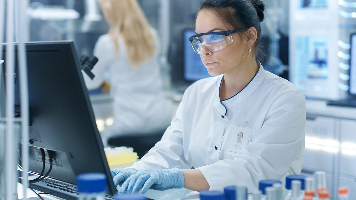 Lab professional using computer