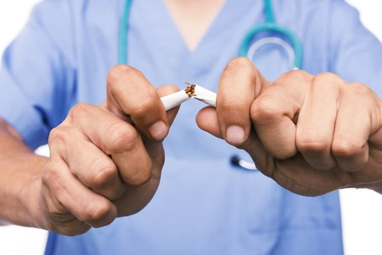 Photo of a doctor breaking a cigarette