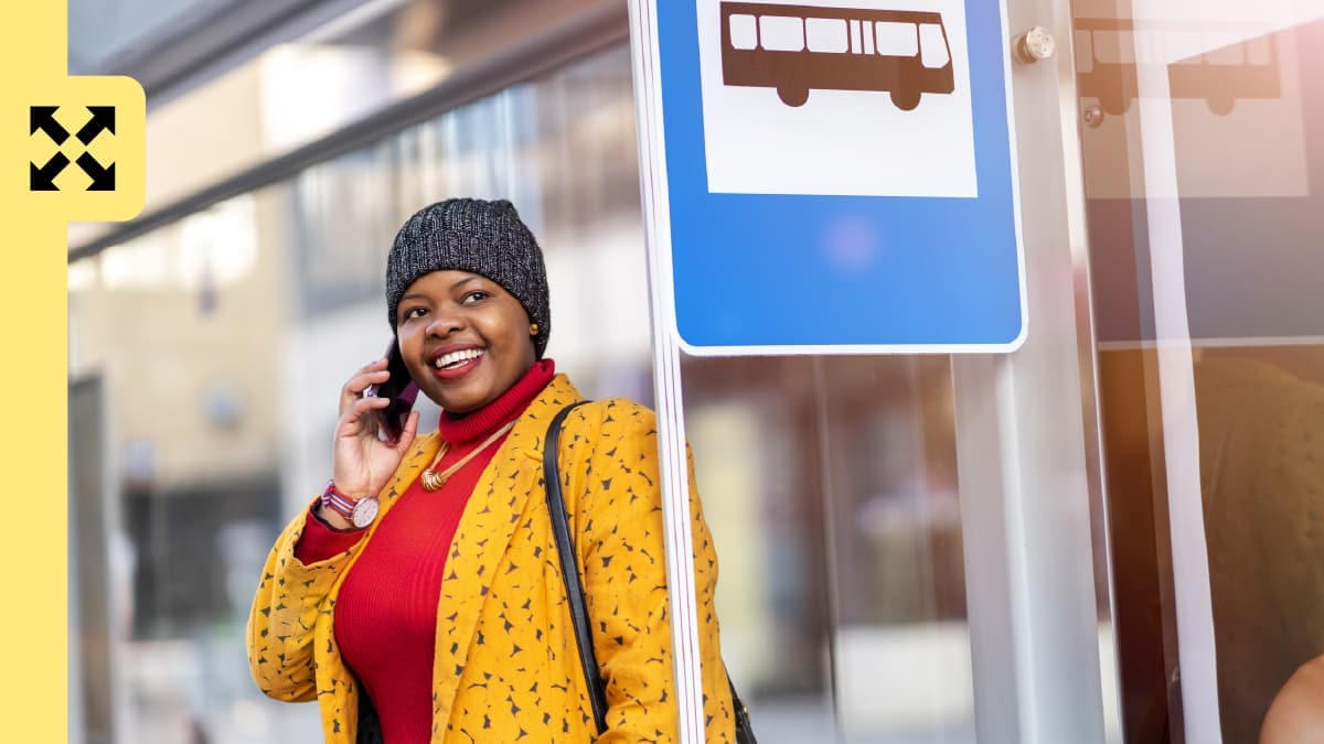 A woman waiting on a bus stop.