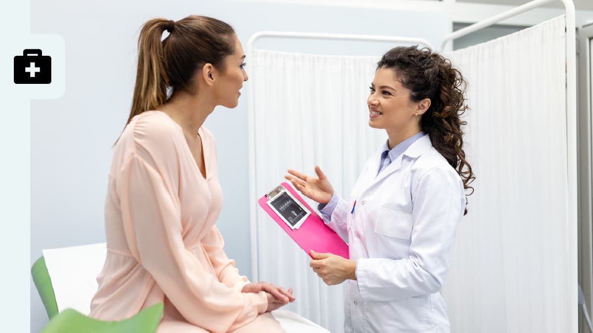 A healthcare professional talking to her patient.