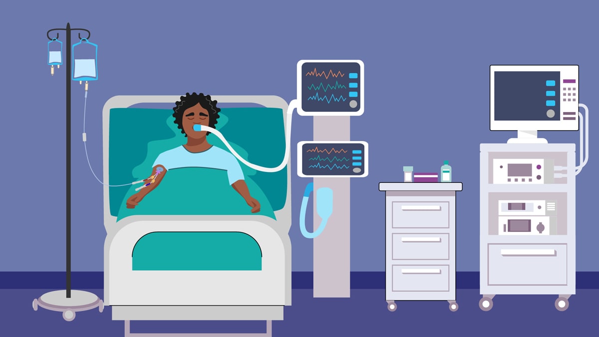 Patient in hospital bed connected to invasive medical devices and an IV.