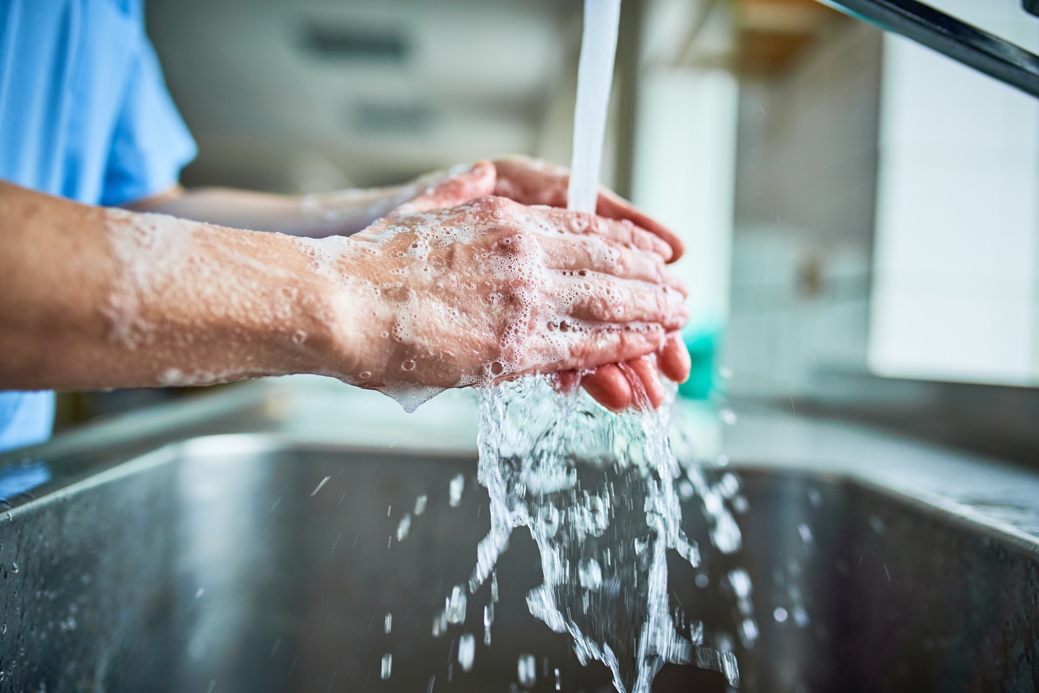 A healthcare provider thoroughly washing hands