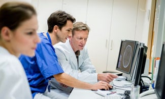 images of health care workers looking at screens