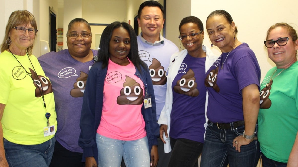staff at the St. Petersburg medical home wearing humorous T-shirts to promote colorectal cancer screening with a FIT kit.