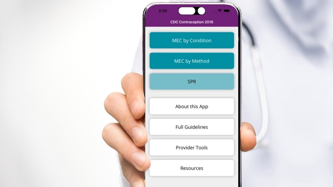 person holding phone showing CDC Contraception app.
