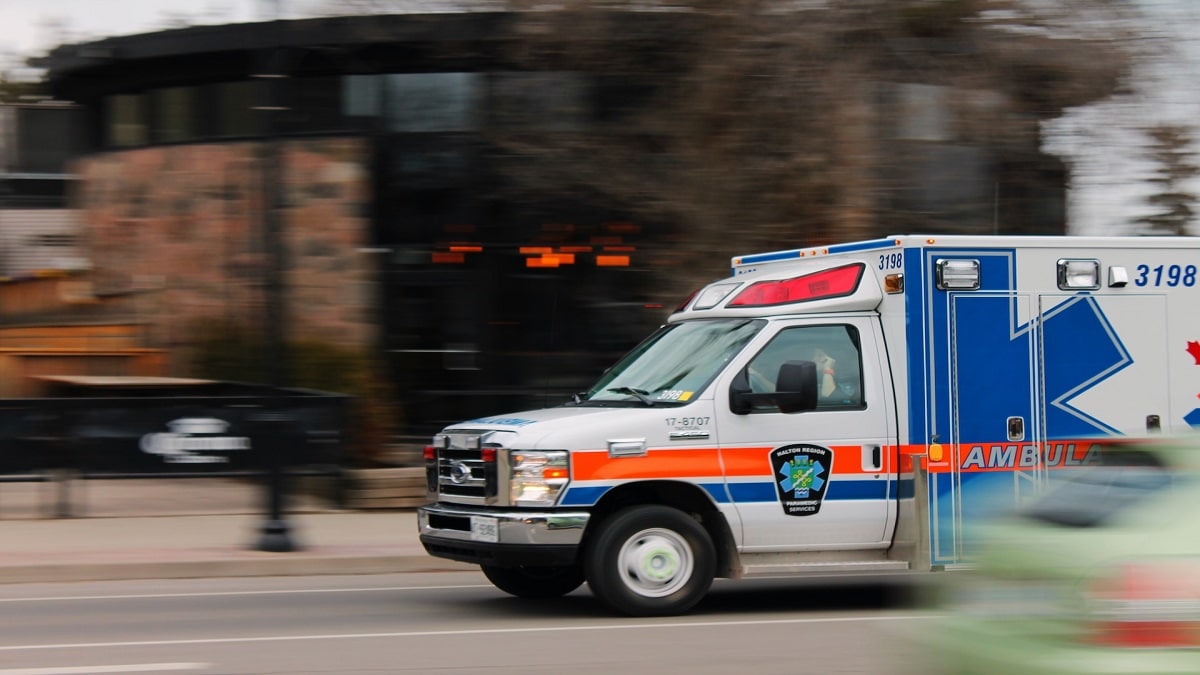 An ambulance speeding down the road.