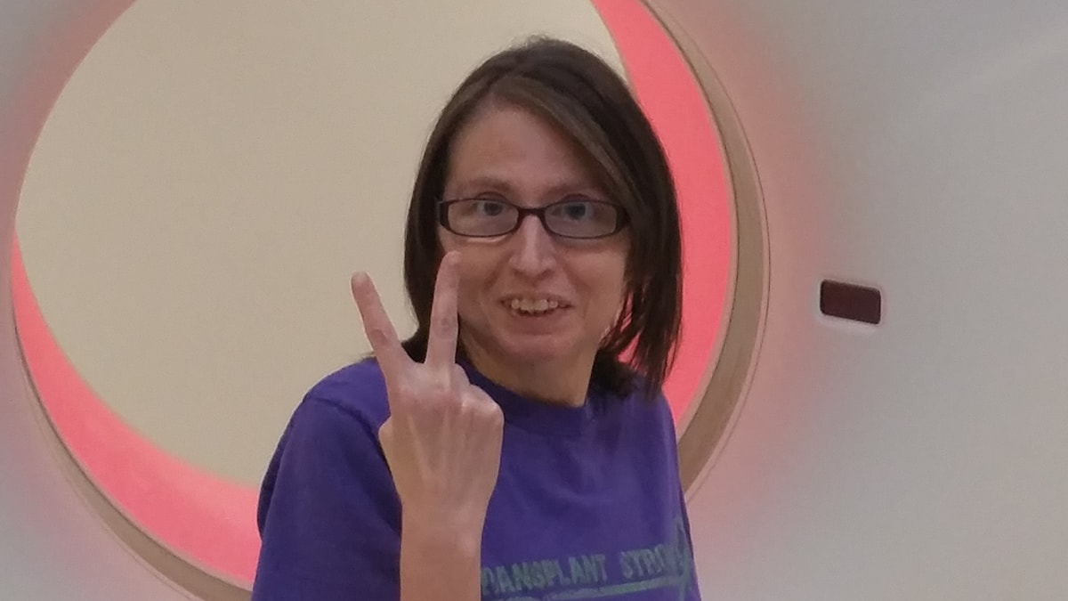Woman giving a peace sign